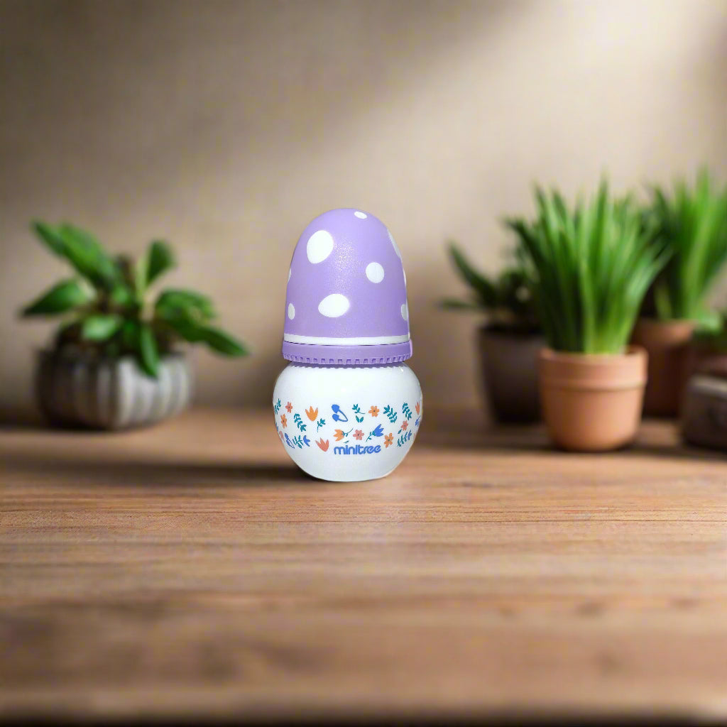 Purple and white children's night light on a white wall