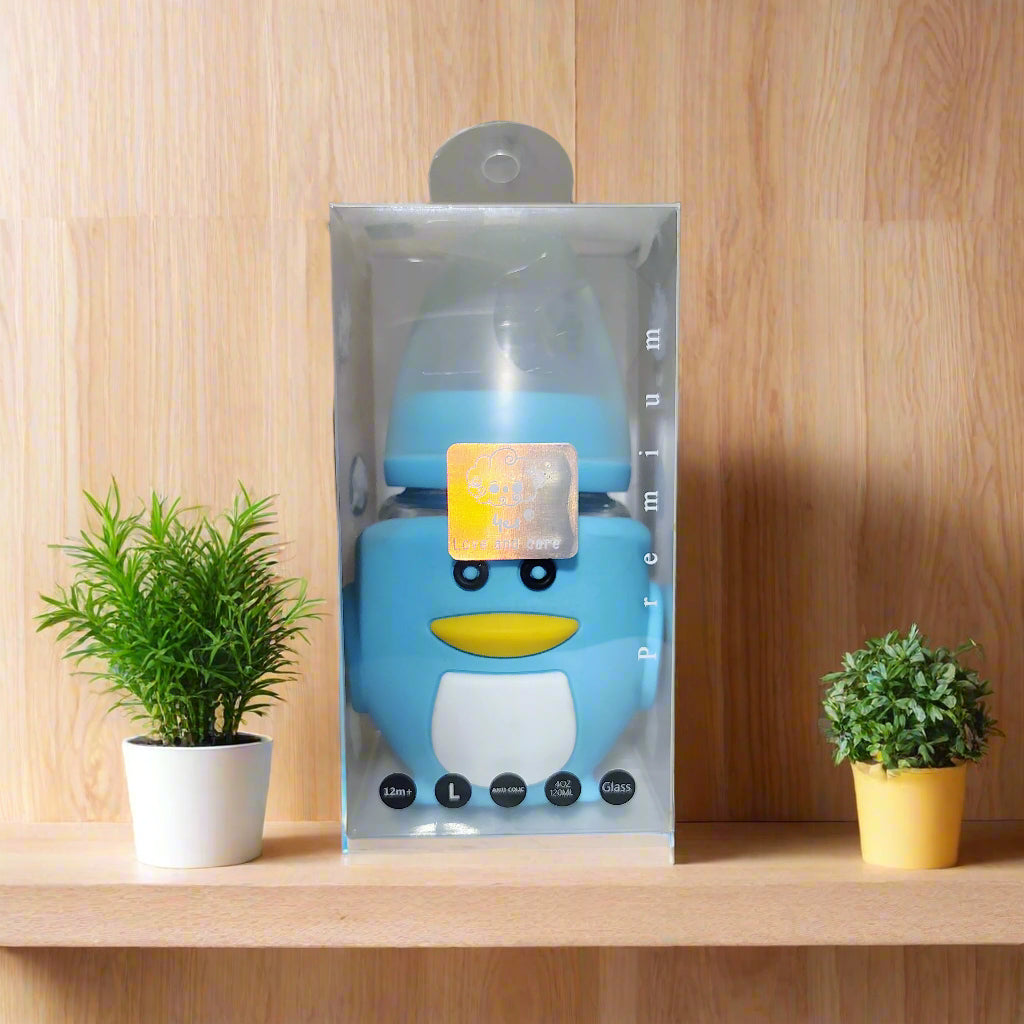 Blue cartoon character bottle in clear packaging on a white surface with a blurred background